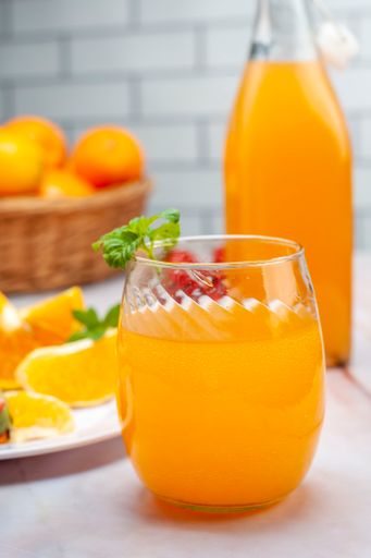 A shallow focus of a glass of fresh orange juice