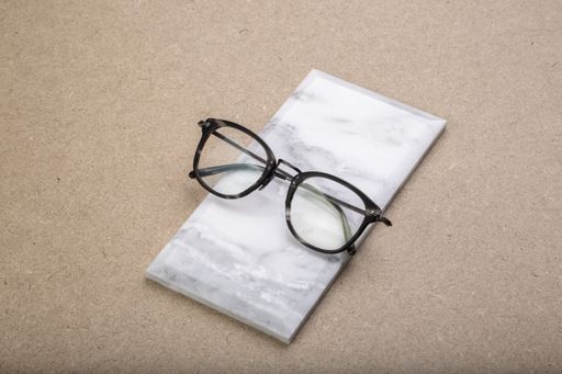 A closeup shot of elegant glasses on a small marble surface
