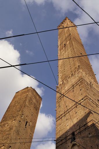 A low angle shot of the Towers of Bologna in Bologna, Italy