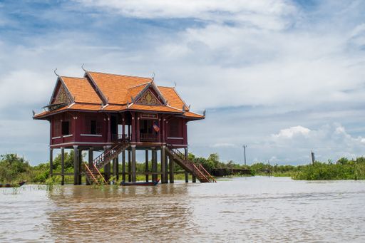 Wooden and metal houses and buildings built on stilts above the water of Tonle Sap lake in village of Kampong Phluk, Siem Reap, Cambodia, Asia