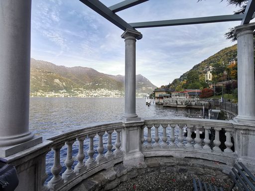 A view to a beautiful seascape from a balcony with stony railings