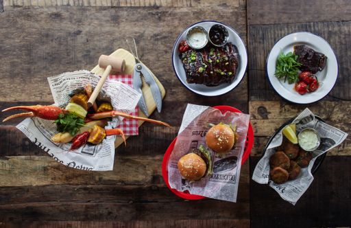An overhead shot of different dishes on a wooden surface