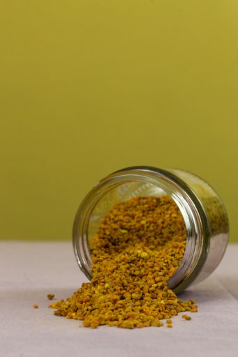 A closeup shot of pollen coming out of a dropped jar