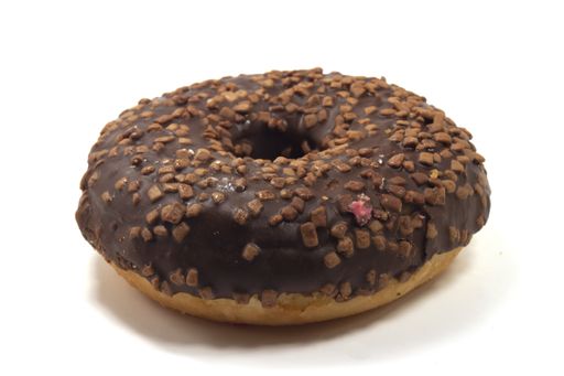 A closeup of a delicious chocolate doughnut on the table isolated on a white background