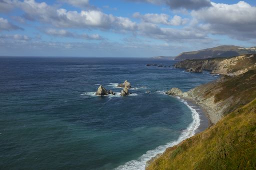 The coast of Loiba surrounded by the sea under a cloudy sky at daytime in Galicia in Spain