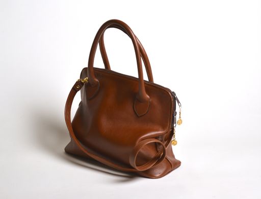 A beautiful brown leather purse isolated on a white background
