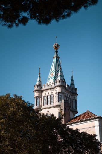 A vertical shot of Sintra City Hall tower external view against a clear blue sky in Portugal