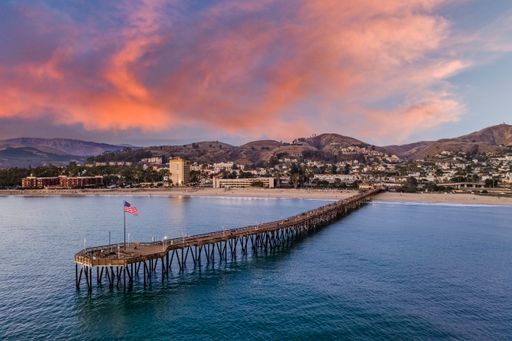 A pier on a beach during sunset in Ventura, California