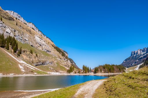 The view of Seealpsee lake in the Alpstein range of the canton of Appenzell Innerrhoden