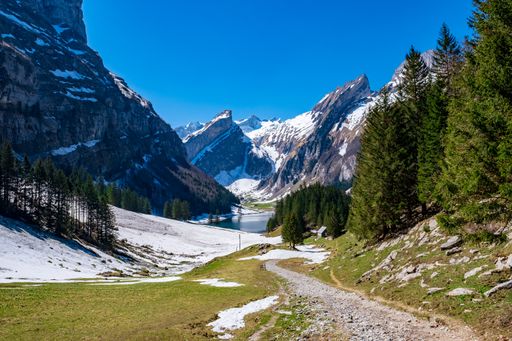 The view of Seealpsee lake in the Alpstein range of the canton of Appenzell Innerrhoden