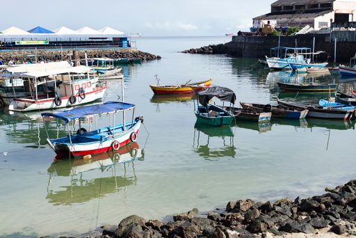 Boats docked on the deck of the Sao Joaquim fair in Salvador on a sunny day. Bahia, Brazil