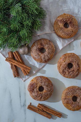 A vertical top view of delicious Christmas gingerbread donuts