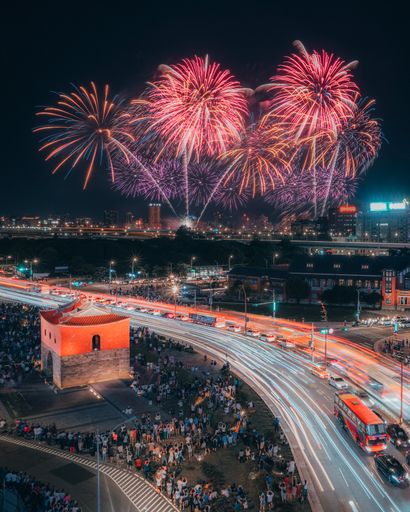 A beautiful scene of colorful fireworks in the night sky on the city of Taipei city at night
