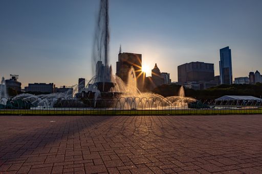 The Buckingham Fountain with the new buildings (skyscrapers) of Chicago, USA at sunset