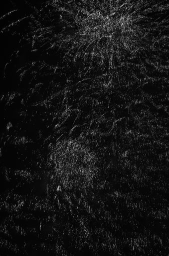 Dark sky with white particles after fireworks. Perfect to use as backdrop, overlay, montage, brushes or textures. Black abstract, grungy background.