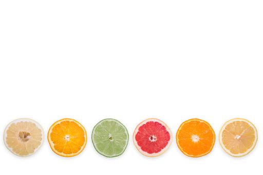 A set of fresh citrus slices isolated on white background with copy space