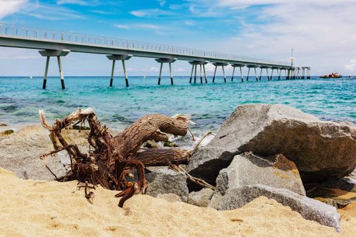 Oil Bridge located in Badalona,Spain - Panoramic view of the bridge resting on the rocks.