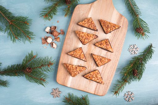 Nut corner, traditional german sweets called Nussecke, covered with chocolate, christmas baking