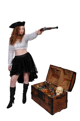 A vertical shot of a pretty pirate holding a flintlock pistol islated on a white background