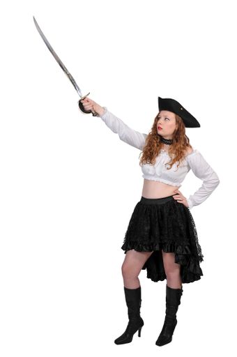 A vertical shot of a young pirate wearing a skirt and holding a cutlass isolated on a white background