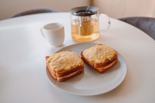 A vertical closeup shot of classic French specialty, croque-monsieur with grilled cheese