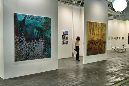 Many paintings on the walls for exhibition during the "Artissima" contemporary art fair in Turin