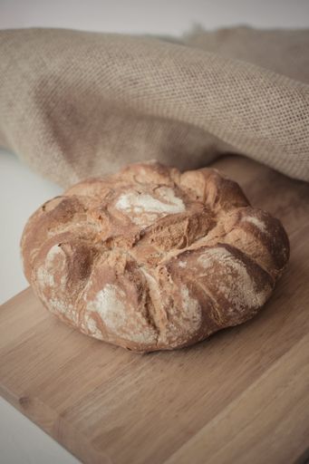 A freshly baked bread on a wooden board