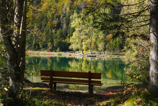 A bench near the lake in Tyrol mountains, Austria