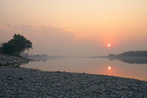 A beautiful shot of a river and its shores during the sunset