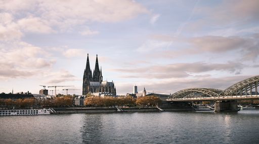 The cloudy sky over the Cologne Cathedral and the Hohenzollern Bridge