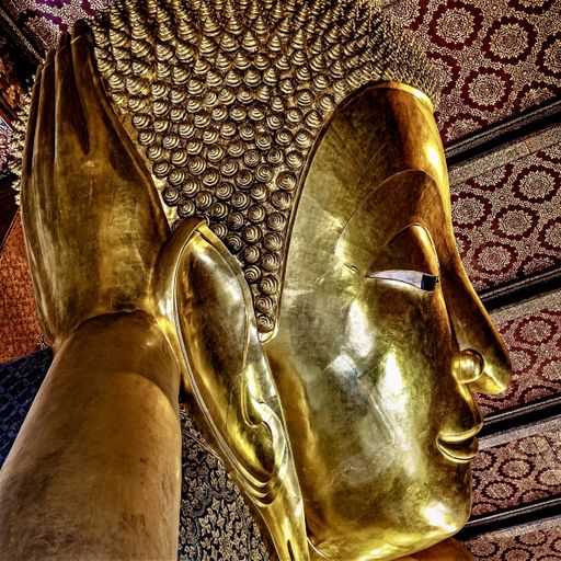 A closeup shot of a reclining Buddha in Wat Pho Temple, Bangkok, Thailand