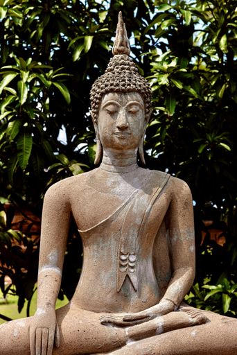 A beautiful vertical shot of Buddhist statue - religious concept
