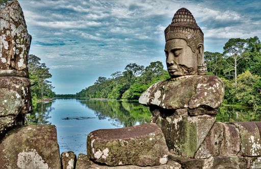 An old Buddha statue near the river