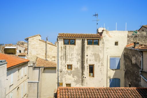 The typical walls and roofs of old buildings at Arles, France
