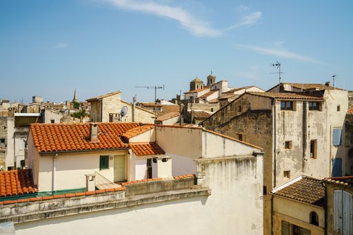 The exterior and roofs of old buildings in Arles, France