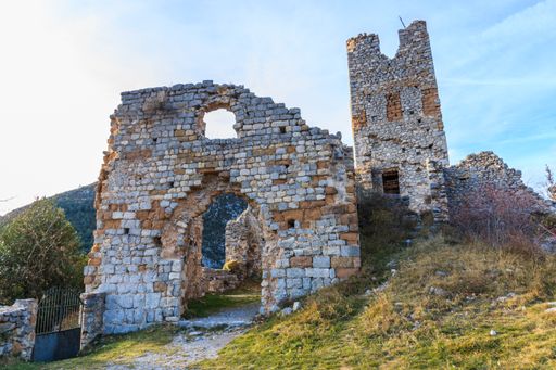 A closeup of ruined buildings on a hill