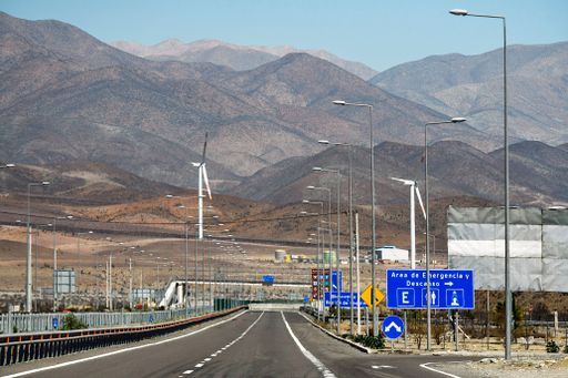 The hills and the agricultural field with wind turbines in the northern part of Chile at daytime