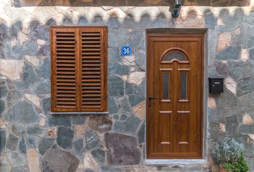 A old house entrance door out of wood brick wall
