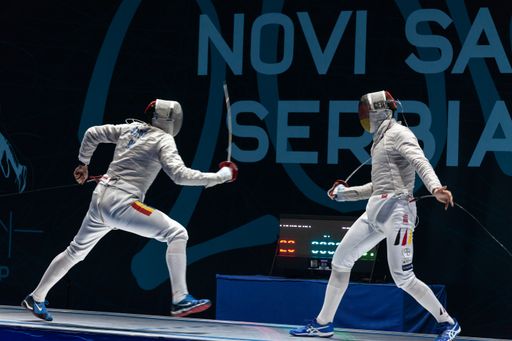 Two swordsmen fighting in fencing championship in Novi Sad, Serbia.