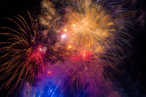 A beautiful shot of a colorful fireworks at night in the sky