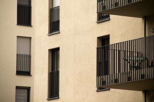 The balconies and windows of a modern residential building in Frankfurt, Germany