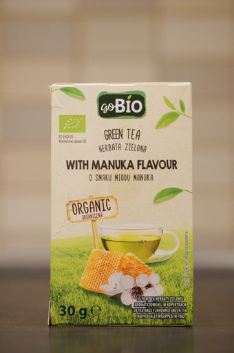 A closeup shot of Go Bio brand green tea with manuka flavor in a box