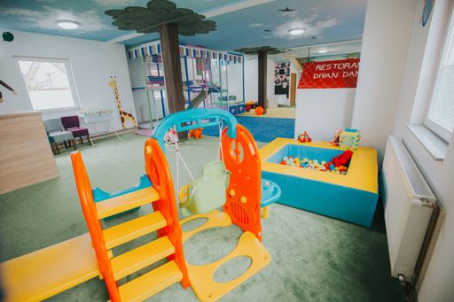 A wide shot of boys and girls playground area at a daycare center