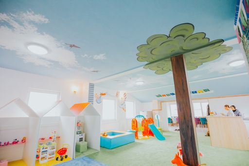 A wide shot of boys and girls playground area at a daycare center