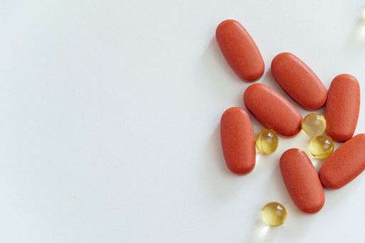 A top view of medical pills and vitamins isolated on a white background