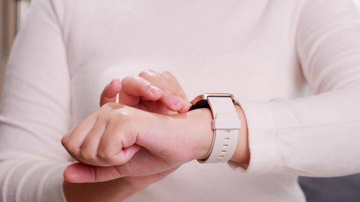 Close-up shot of a woman hand who touch and scrolling on a smartwatch in order to quickly check application connect. Technology online IOT concept
