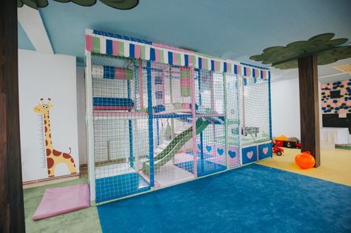 A wide shot of a colorful daycare center playground