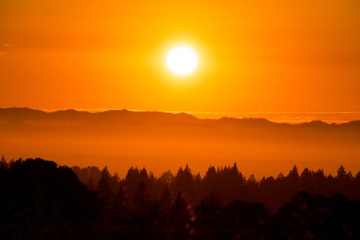 An orange sunrise over the mountains in Sonoma County, California, USA