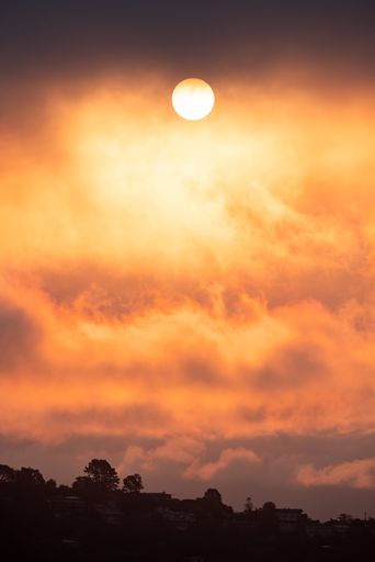 A vertical shot of an orange sunrise over Richardson Bay in California, USA