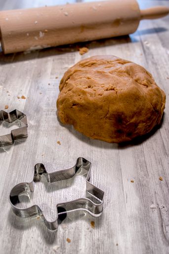 A vertical closeup of the material for making gingerbread and cinnamon cookies.